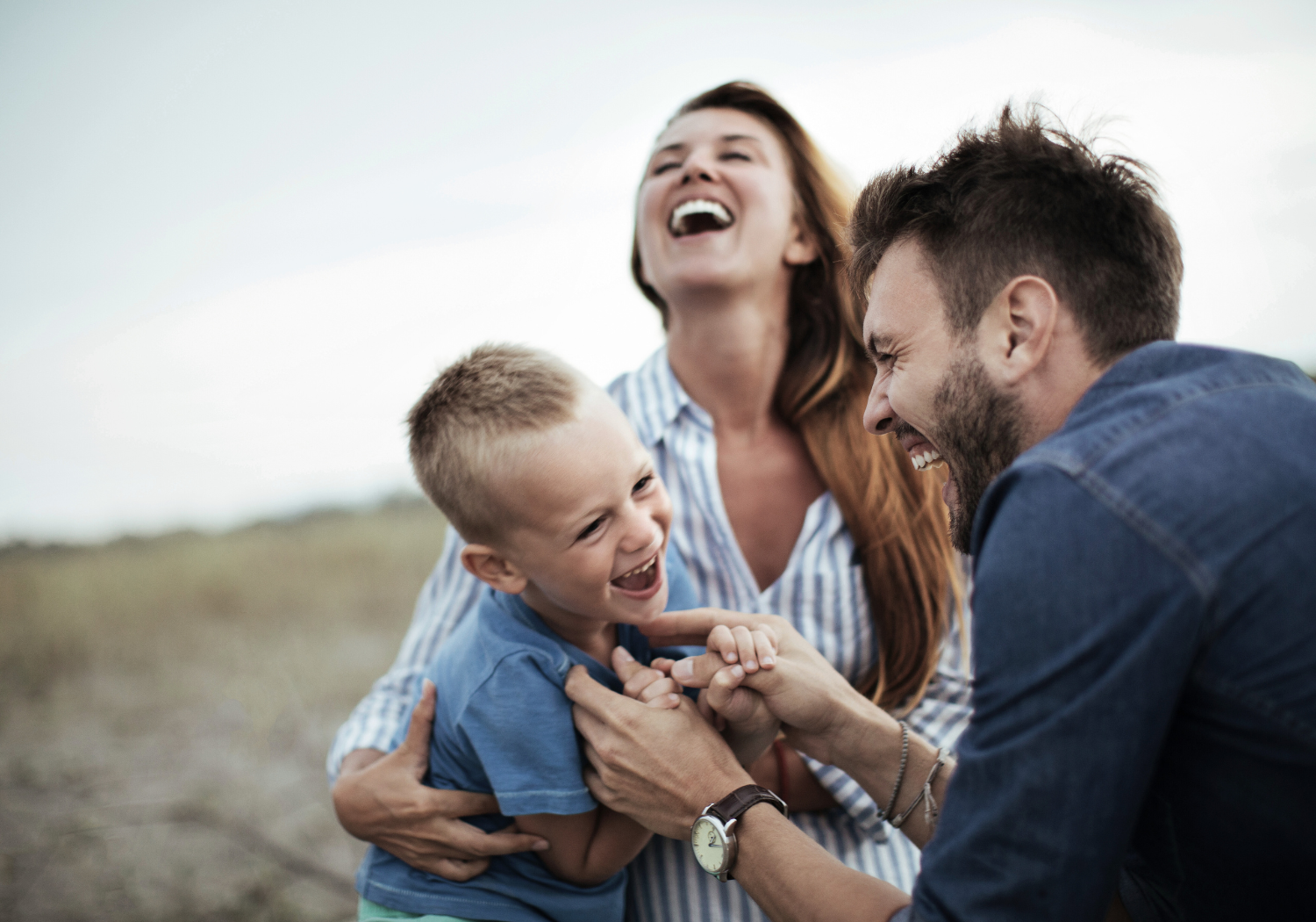 young family with a child enjoying time together outside