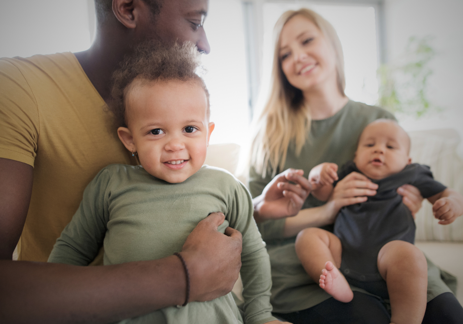 parents holding their kids