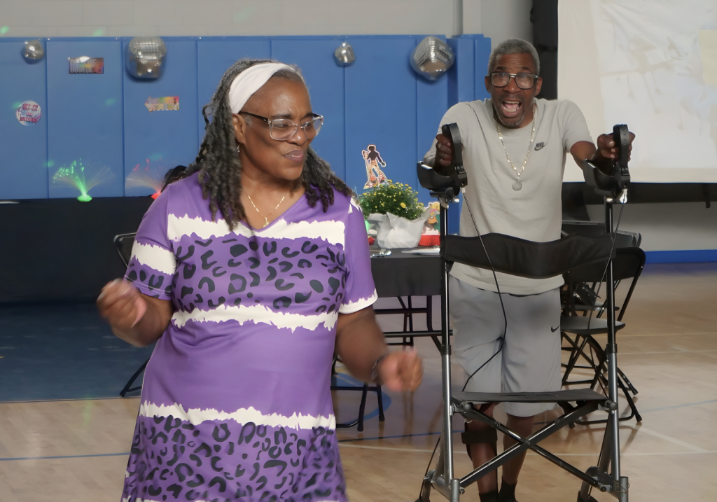 two people dancing at senior programs event